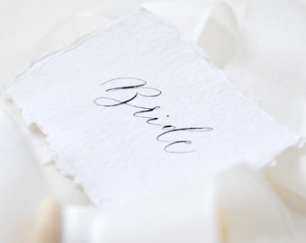 Sustainable wedding place names - recycled cotton rag paper, black handwritten calligraphy