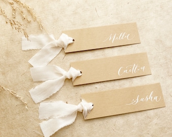 Pale earthy inspired calligraphy wedding place names