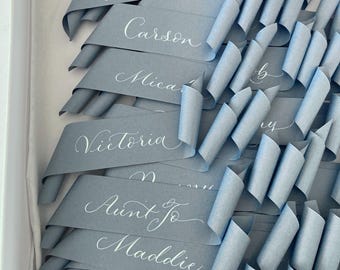 Dusky blue wedding place name scrolls in calligraphy