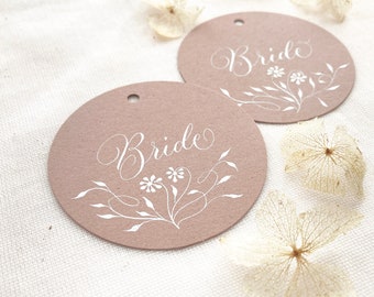 Circular wedding place names with calligraphy, made in the UK from almond colour sustainable recycled card