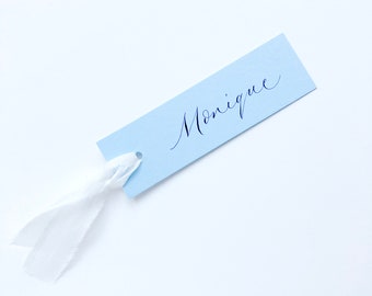 Dusky blue slimline wedding place names with hand calligraphy and optional silk ribbon