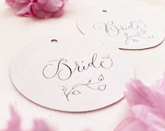 Circular wedding place names with hand calligraphy, made in the UK from sustainable recycled card