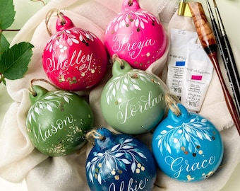 Personalised Christmas bauble with handwritten calligraphy and glitter sparkle in a choice of colours