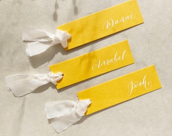 Vibrant yellow wedding place names