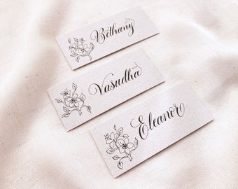 Illustrated botanical wedding place names with hand calligraphy, made in the UK from sustainable recycled card