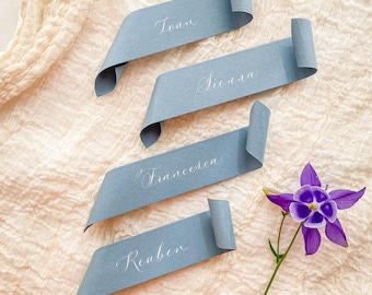 Dusky blue wedding place name scrolls in calligraphy