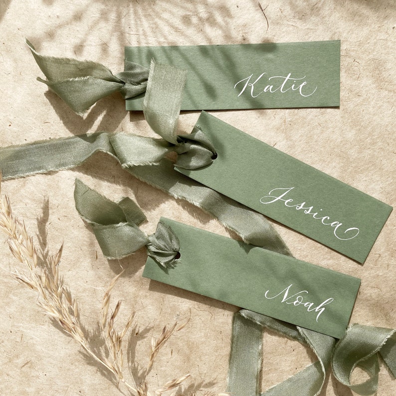 Elegant sage green wedding place names image 1