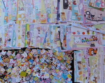 May include: A selection of colourful stickers and decorative paper strips, showcasing diverse cartoon characters and patterns. The stickers vary in shape and size, while the paper strips display repeating designs. The overall theme is cute and whimsical.