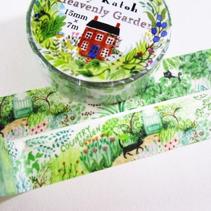 May include: A roll of decorative washi tape with a "Heavenly Garden" theme. The tape features a watercolor design of a red house, garden, and the words "Country Garden". The tape is 15mm wide and 7m long.