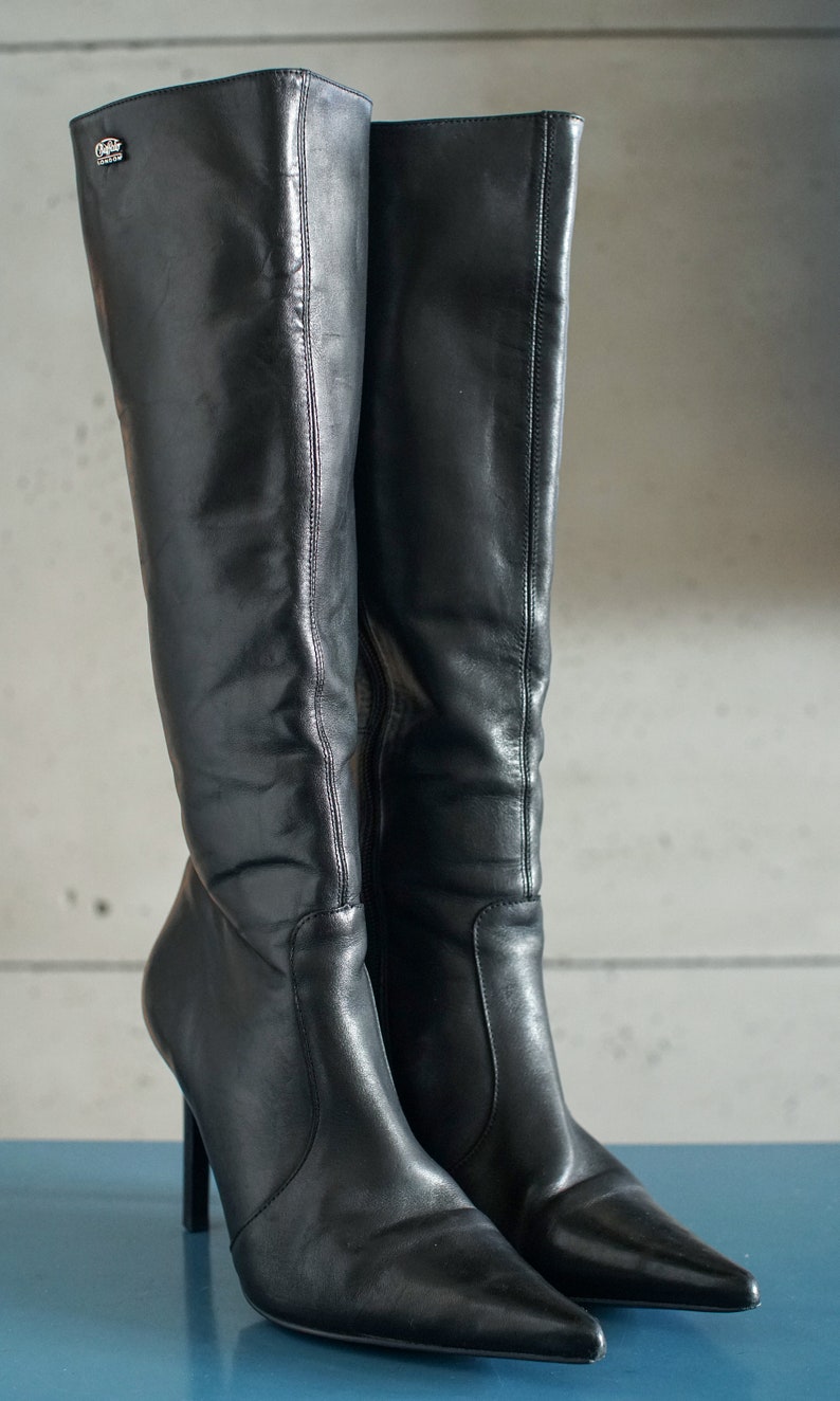 pointy knee high boots