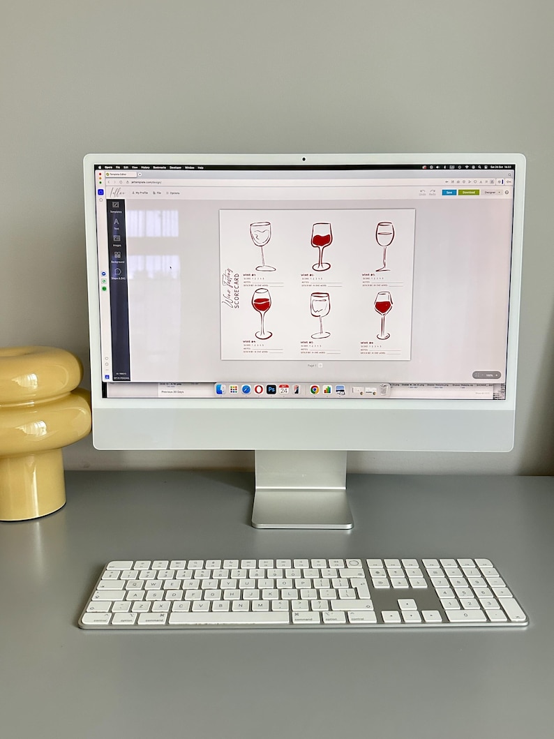 May include: A white computer monitor displaying a digital wine tasting scorecard template. The document features six hand-drawn illustrations of wine glasses, some filled with red liquid, alongside lines for notes and ratings labeled Wine #1 through #6.