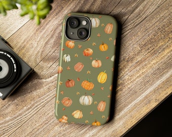 Puede incluir: Una funda de teléfono verde con un patrón de calabazas y hojas naranjas y blancas.
