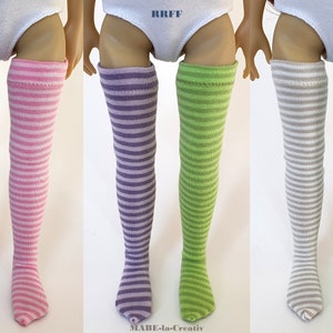 May include: Five pairs of striped knee-high socks for dolls. The socks are in various colors, including purple, pink, green, gray, and blue.