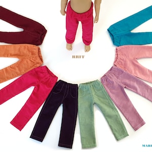 Könnte beinhalten: Ein Set aus zehn Paar Cordhosen in verschiedenen Farben, darunter Burgunderrot, Orange, Rosa, Rot, Lila, Grün, Türkis und Rosa. Die Hosen sind in einem Kreis um eine Puppe angeordnet, die eine rote Cordhose trägt. Der Text "RRFF" ist in der Mitte des Kreises sichtbar.