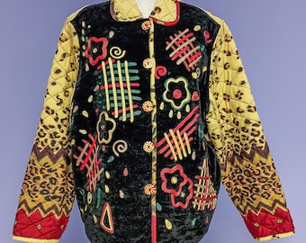 May include: A black velvet jacket with a quilted yellow, brown, and red leopard print design. The jacket has a button closure and features colorful embroidered details.
