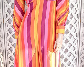 May include: A vintage, long-sleeved dress with a vibrant, vertical striped pattern in shades of orange, pink, and purple. The dress features a plunging neckline and is paired with matching pink boots. The mannequin also wears a yellow headband and earrings.