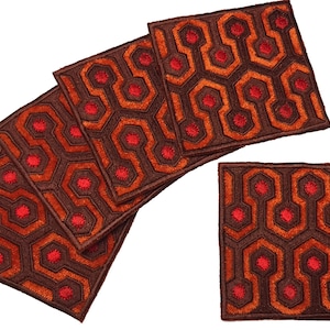 May include: Set of six brown and orange coasters with a red geometric pattern. The pattern resembles the carpet from the movie "The Shining".