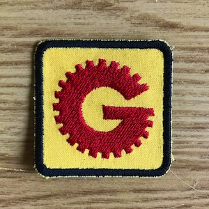 MST3K Gizmonics Yellow G Badge