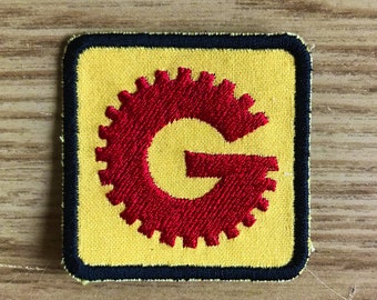 MST3K Gizmonics Yellow G Badge