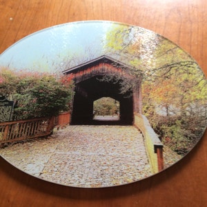 Covered bridge glass cutting board 12 inch round