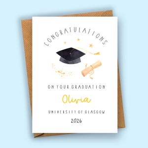May include: A graduation card with a black mortarboard, diploma, and the text "Congratulations." The card is personalized with the name "Olivia," the University of Glasgow, and the year 2026. The card is on a brown envelope.