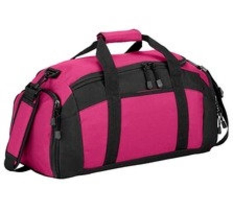 May include: A pink and black duffel bag with a zippered top and a shoulder strap.