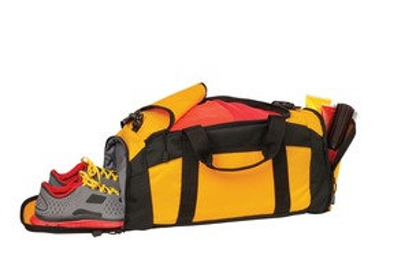 May include: Yellow and black duffel bag with a red lining. The bag has a separate shoe compartment and a zippered pocket on the side.