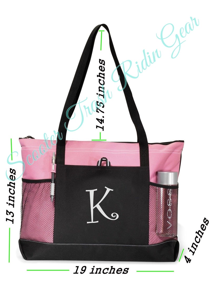 May include: A pink and black tote bag with a mesh pocket and a zippered closure. The bag has a large letter "K" embroidered on the front. The bag measures 19 inches wide, 14.75 inches tall, and 4 inches deep.