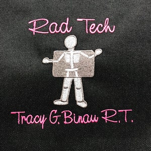 May include: A black bag with pink embroidery that reads "Rad Tech" and "Tracy G. Binau R.T."  A cartoon skeleton holding an x-ray is embroidered in the center.
