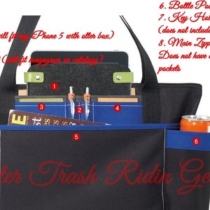 May include: Black tote bag with multiple pockets, including a tablet pocket, pen pockets, and a bottle pocket. Features a large front pocket and a key holder. The bag has a blue accent and the text "Scooter Trash Ridin Gear".