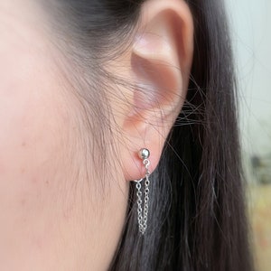 77)Piercing stud ball with chain dangle earrings.