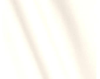 May include: A plain white fabric background.