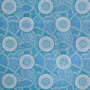 May include: A blue and white patterned fabric with a repeating design of circles and dots. The fabric has a subtle texture and a light blue background.