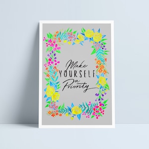 May include: A watercolour illustration of a floral wreath with yellow, pink, orange, and blue flowers. The text "Make yourself a priority" is written in black inside the wreath.
