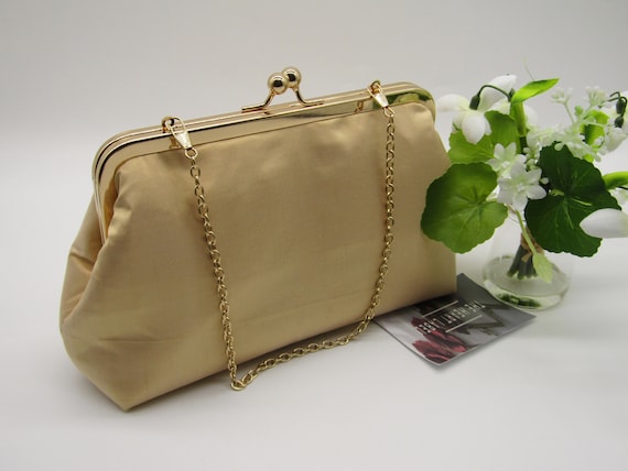 Silk clutch bag Adolfo Dominguez Gold in Silk - 32882619