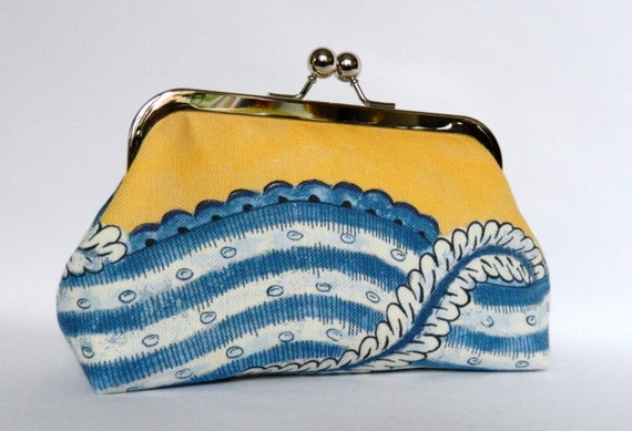 blue and yellow clutch bag