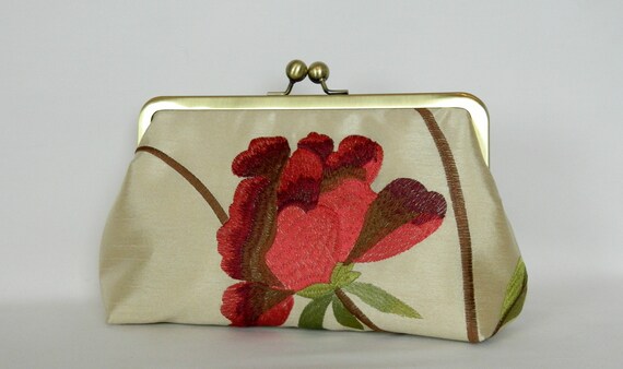 red and gold clutch bag