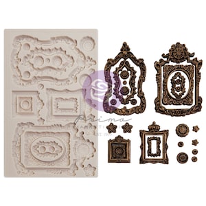 May include: A silicone mold with 14 different ornate frame designs. The mold is white and the frames are in a gold color. Prima Marketing Est. 1999 is printed on the mold.