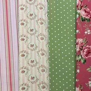 May include: Four fabric swatches with different patterns. One has pink and white stripes, another has pink roses on white stripes, a third has white polka dots on green, and the last has pink roses on a red background.