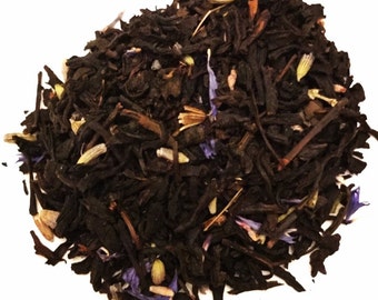 May include: A close-up of a blend of black tea leaves with dried lavender and cornflower petals.