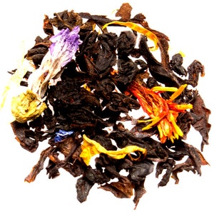 May include: A blend of black tea leaves, dried flowers, and fruit pieces. The tea blend includes purple, blue, yellow, and orange flower petals.