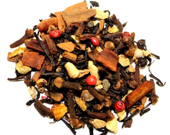 May include: A close-up of a blend of black tea, spices, and dried fruit. The mixture includes cinnamon sticks, cloves, ginger, peppercorns, and dried orange peel.