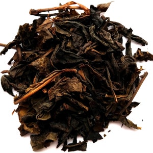 May include: Loose leaf black tea with brown and green leaves.