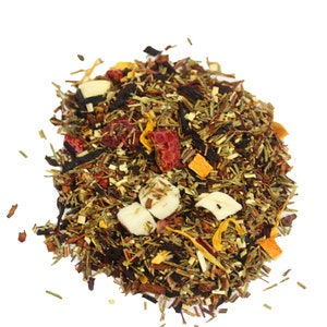 May include: A loose leaf tea blend with a mix of green, red, and orange pieces, along with white and red fruit pieces.