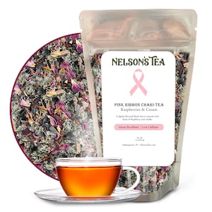 May include: A pink ribbon with the text "NELSON'S TEA" above it and "PINK RIBBON CHARI-TEA Raspberries & Cream" below it. The text "Green Tea Blend | Low Caffeine" is at the bottom of the image. The image also shows a bag of loose leaf tea with a cup of tea in the foreground.