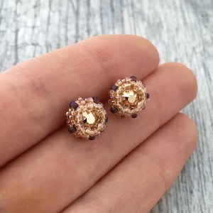 rose gold crystal post earrings. small metallic blush studs. tiny peach earrings. metallic rose gold. earrings with a crystal. beaded studs