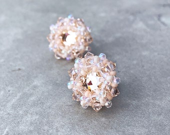 light pink crystal stud earrings. peach beaded woven jewelry. pastel pink earrings. sterling silver posts