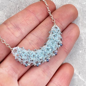 icy blue crystal bar pendant. minimalist statement necklace. crystal layering necklace. curved bar necklace. pastel blue