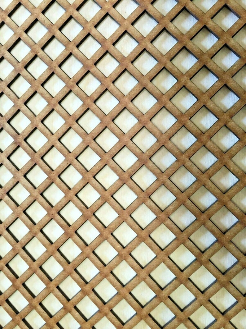May include: A brown wooden panel with a repeating diamond pattern cut out. The panel is made of wood and has a light brown color.