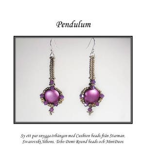 May include: A pair of purple and gold dangle earrings with a cushion bead at the bottom. The earrings are called "Pendulum" and are made with cushion beads, Swarovski Xilions, Toho Demi Round beads, and Mini Duos.